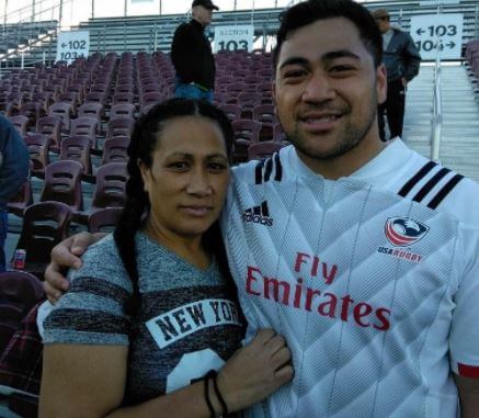 Titi Lamositele with his mother at the stadium.